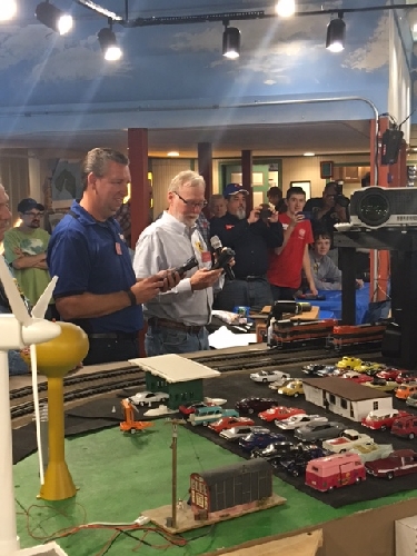 At the official ribbon cutting ceremony of the Chicagoland Lionel Railroad Club brand-new running layout Hitchcock and Koch participated in the official ribbon cutting ceremony Hitchcock and Koch participated in the official ribbon cutting ceremony of the CLRC brand-new running layout