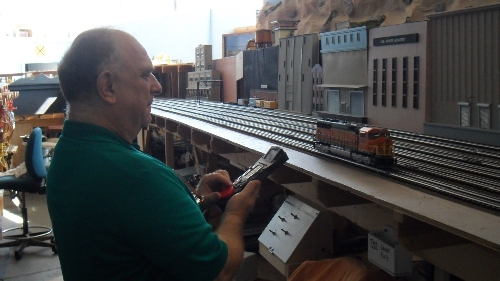 Club Member Randy throttling up his engine on the TMB Model Train Club Lionel Club Ambassador model train layout