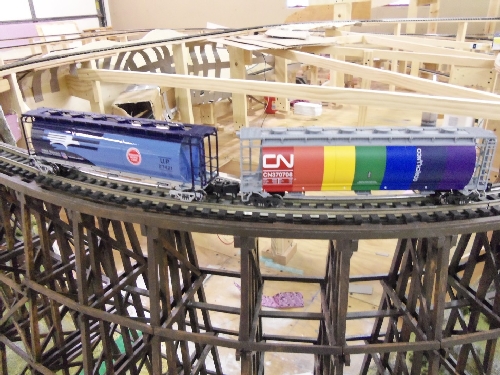 Lionel Club Ambassador Wichita Toy Train Club pictures the Canadian National 6-48639 Hopper and the 6-48641 UP Heritage MoPac Hopper on their layout for their product review The Canadian National 6-48639 Hopper and the 6-48641 UP Heritage MoPac Hopper on the layout for the product review by the Lionel Club Ambassador Wichita Toy Train Club
