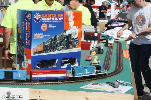 Amongst the modular layout displayed byt TMB Model Train Club Lionel Club Ambassador youll see Boston Maine Railroad going by with many accessories The Boston Maine Railroad Train set going down the tracks is amongst the activtiy modular layout displayed by TMB Model Train Club Lionel Club Ambassador