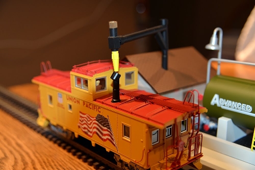 Caboose is lined up and ready to load with Lionels Smoke Fluid Loader 6-37821 in New Jersey Hi-Railers Club Ambassadors to Lionel product review Product review Lionels Smoke Fluid Loader 6-37821 in New Jersey Hi-Railers Club Ambassadors to Lionel image of loader with caboose