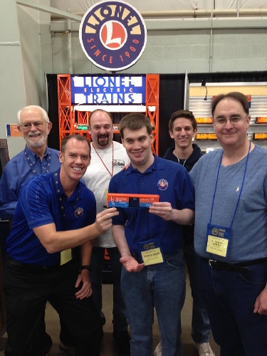 The Lionel Team gather and take part in the LCCAs Switching Tracks Traveling Boxcar fun with Train Fans The Lionel Collectors Club of Americas Switching Tracks Traveling boxcar brings lots of fun to the Lionel Team and train fans
