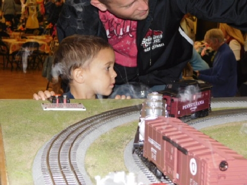 At the Winter Craft Fair parents and kids wanted to activate the operations of the layout set up by the NLOE Lionel Club Ambassador NLOE a Lionel Club Ambassador had parents and kids wanting to activate the operations of the layout at the Winter Craft Fair