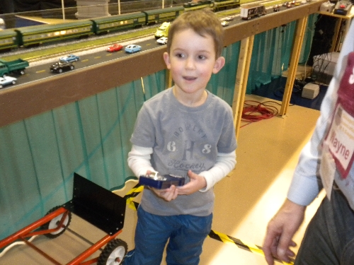 Ambassador to Lionel Chicagoland Association of S Gaugers captures a boys reaction when using the remote at Harper College in Palatine IL  CASG Lionel Club Ambassador finds amazement when in control at High Wheeler 16 Show