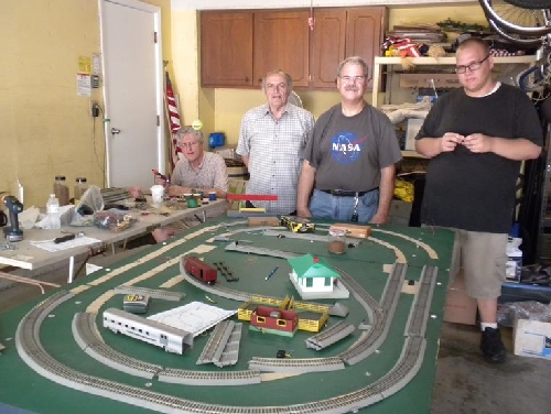 CASG Lionel Ambassador Club Crew work to revamp the portable layout with American Flyer FasTrack Chicagoland Association of S Gaugers Lionel Ambassador Club Crew work to revamp the portable layout to include American Flyer FasTrack