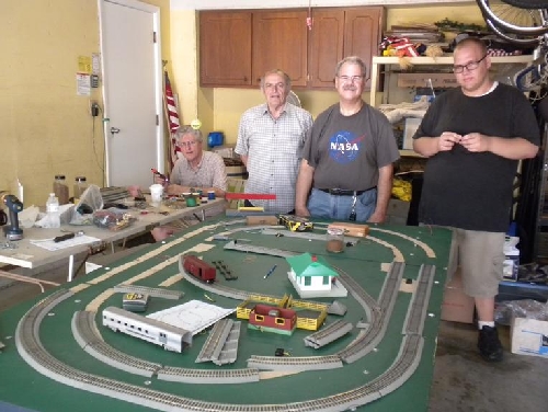  Chicagoland Association of S Gaugers Lionel Ambassador Club Crew work to revamp the portable layout to include American Flyer FasTrack 