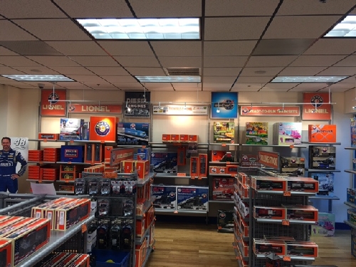 Shelves full of Trains and Nascar in the Lionel Retail Store visited by NJ Hi-Railers Lionel Ambassador Club when at Lionel in Concord NC New Jersey Hi-Railers Lionel Ambassador Club visit Lionel in Concord NC and find the shelves stocked with Trains and Nascar in the Lionel Retail Store