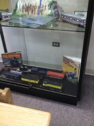 Module train dsiplay located at The Chicago Public Library - Bessie Coleman Branch shows CNW trainsitems contributed by the Chicagoland Lionel Railroad Club Lionel Club Ambassador Chicagoland Lionel Railroad Club Lionel Club Ambassador contributes CNW ote to a module train dsiplay located at The Chicago Public Library - Bessie Coleman Branch