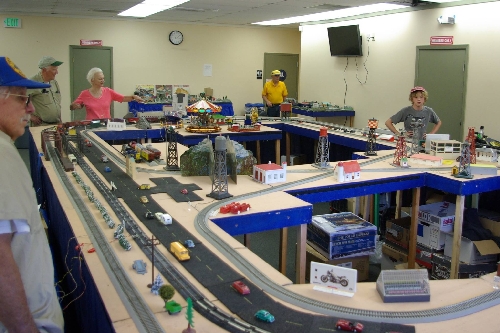 An overview of the Golden Gate American Flyer Club Lionel Ambassador modular layout at the Golden State Model Railroad Museum in Richmond CA July 23-24 and July 30-31 Image at the Golden State Model Railroad Museum in Richmond CA on July 23-24 and July 30-31 shows an overview of the modular layout set up by the GGAF Club CLUB AMBASSADORS TO LIONEL
