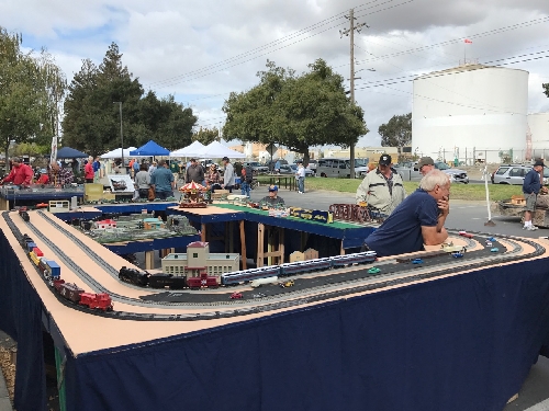 On the Golden Gate American Flyer Club Lionel Club Ambassador layout in Concord CA attendees at the Just Trains Hobby Shop check out some American Flyer trains 