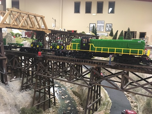 Looking great on the Lionel Club Ambassador WTTC layout is The John Deere Ready-to-Run Train with the Flatcar w2 spreaders The John Deere Flatcar w2 spreaders and Ready-to-Run Train set looks great on the Lionel Club Ambassador WTTC layout