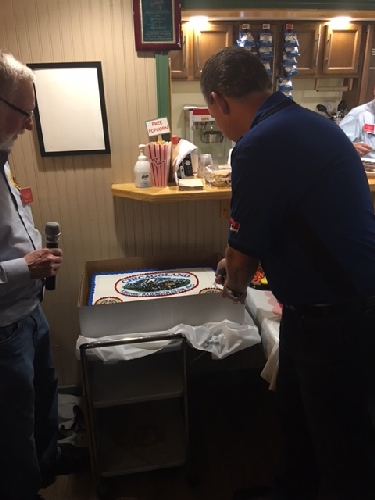 At the CLRC 2015-2016 Lionel Club Ambassador winners presentation Lionels President cuts the cake