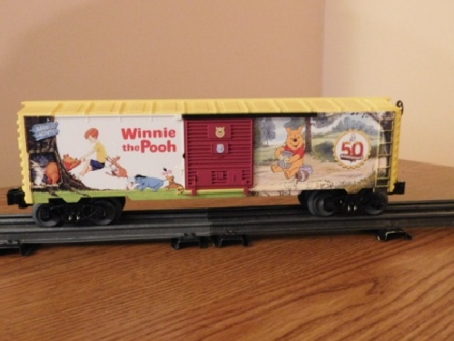 From the product review by the Nassau Lionel Operating Engineers a Lionel Club Ambassador the art on the side view of the Winnie the Pooh 50th Anniversary Boxcar 6-82913 View of the art on the side of the Winnie the Pooh 50th Anniversary Boxcar 6-82913 in the product review by the Nassau Lionel Operating Engineers a Lionel Club Ambassador