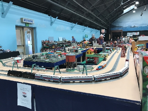 Set up by the GGAF Club Lionel Club Ambassador at the Just Trains Hobby Shop on October 2 the FlyerChief Polar Express Berkshire makes its way around the track