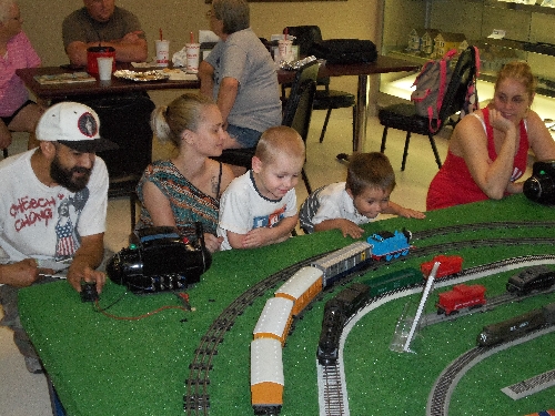 At the WTTC Open House Club Ambassadors to Lionel the first weekend of August 2016 kids look on for Thomas the Train run down the track