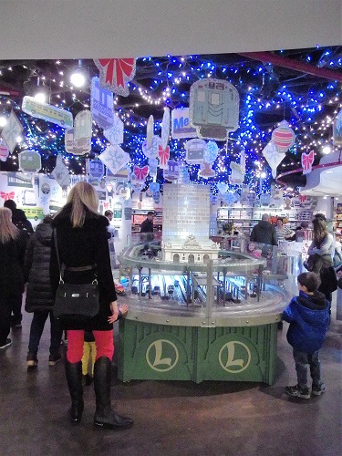 At the Grand Central Train Show in New York families view the elaborate layout in amazement Families view the elaborate layout in amazement at the Grand Central Train Show in New York