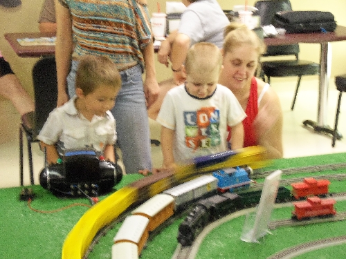 Kids look on for Thomas the Train when another train takes the outer loop at top speed during the WTTC Open House Club Ambassadors to Lionel the first weekend of August 2016