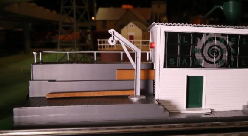 Showing the blinking light as the cut board comes out of the operating Sawmill with Sound for the review by the CLCR Lionel Club Ambassador The CLRC Lionel Club Ambassador shows the blinking light when the cut board comes out in the review of the operating Sawmill with Sound